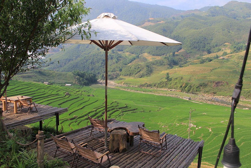 Spectacular view over Muong Hoa Valley's rice fields from Sailing Sapa café, offering the best panoramic viewpoint in the valley